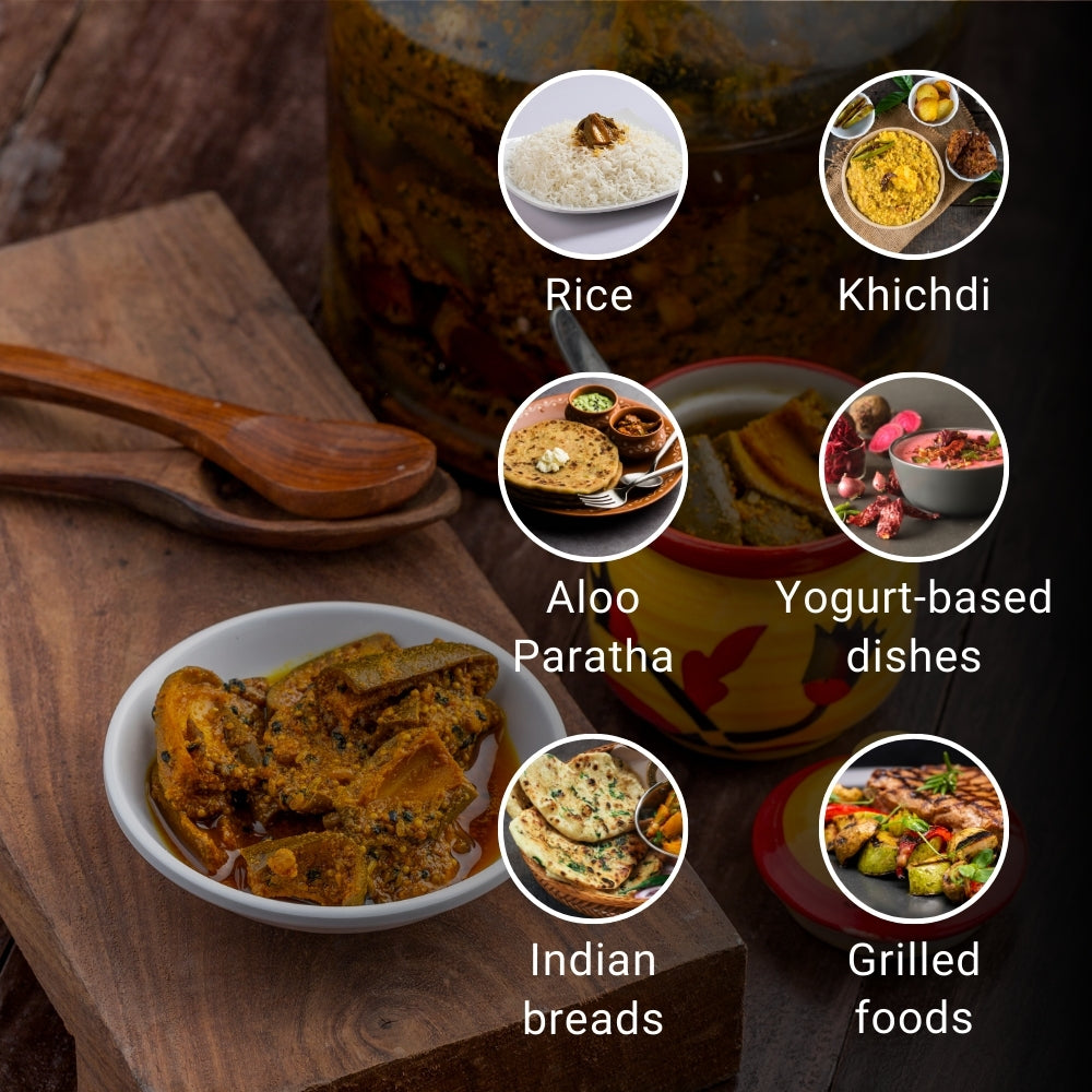 This image is a food-serving suggestion visual centered around a jar of mango pickle, “First Bud Organics Homemade Mango Pickle