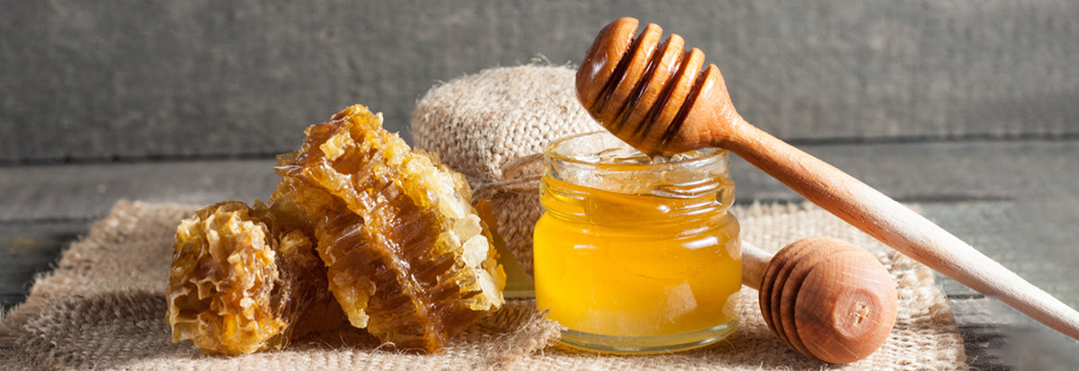raw honey jar honeycomb organic honey natural sweetener wooden dipper pure honey golden nectar healthy food immunity boosting honey rustic background