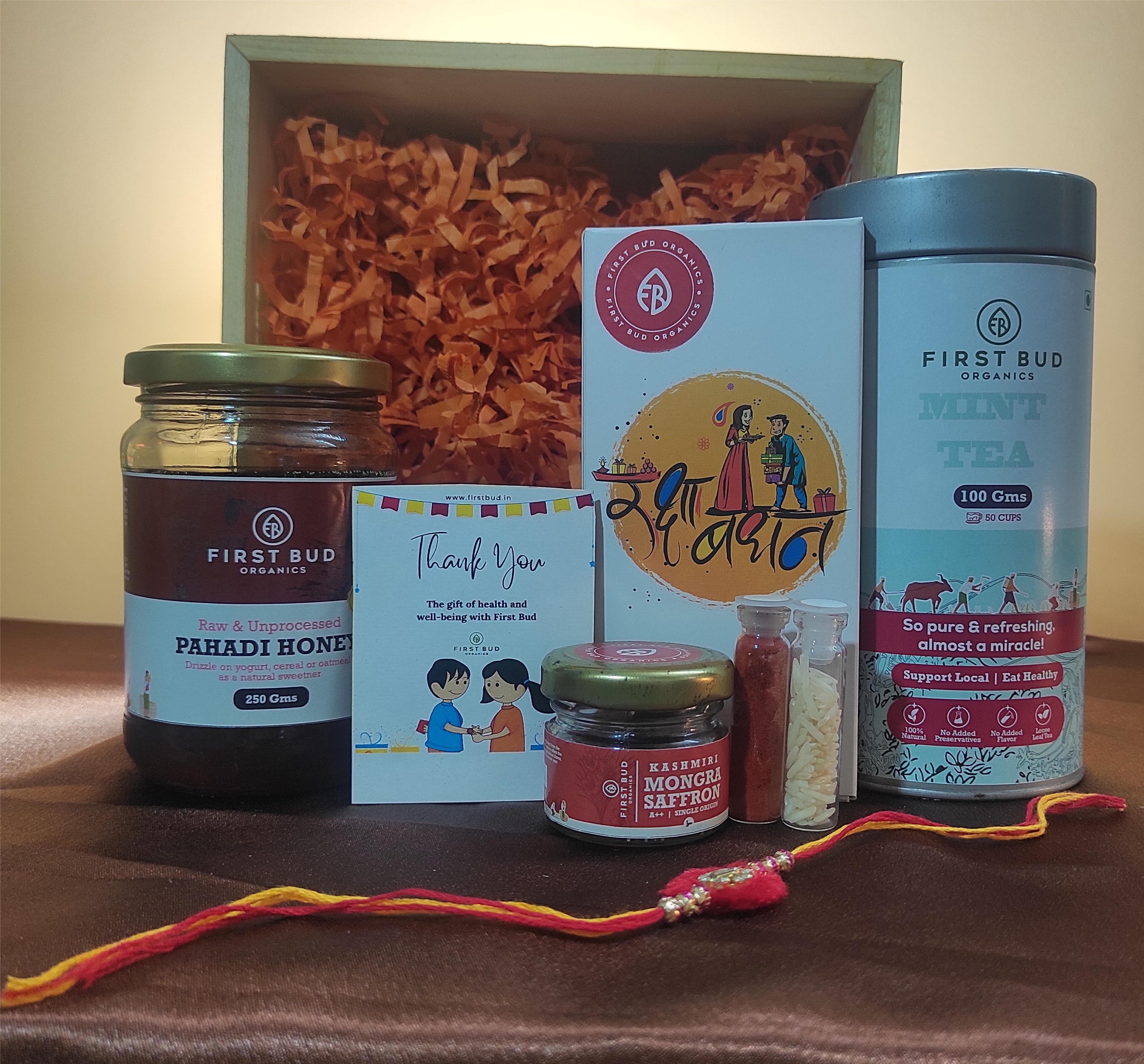 Rakhi Gift Hamper - Lemongrass Mint Herbal Tea, Pahadi Multiflower Honey, Kashmiri Saffron,Chocolates & Rakhi Set