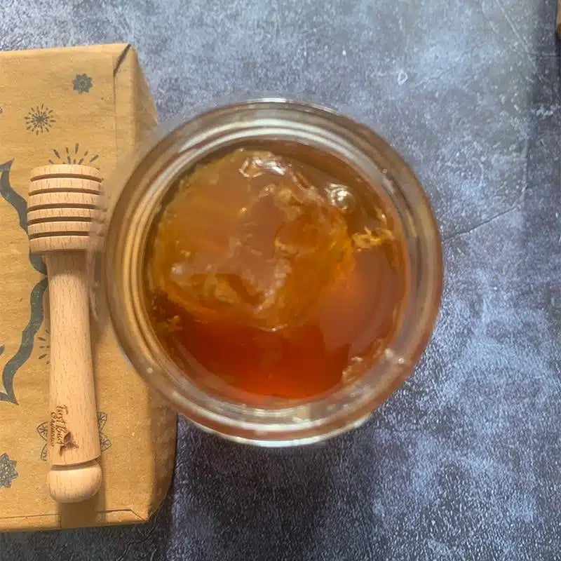 raw natural honey in glass jar, organic honey dipper, pure unprocessed honey, golden honey texture, healthy natural sweetener, antioxidant rich honey