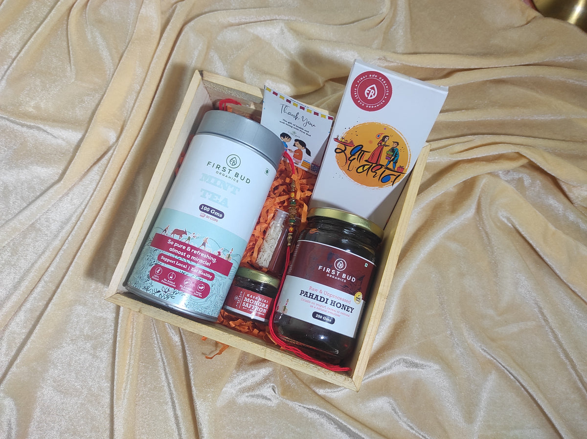 Rakhi Gift Hamper - Lemongrass Mint Herbal Tea, Pahadi Multiflower Honey, Kashmiri Saffron,Chocolates &amp; Rakhi Set