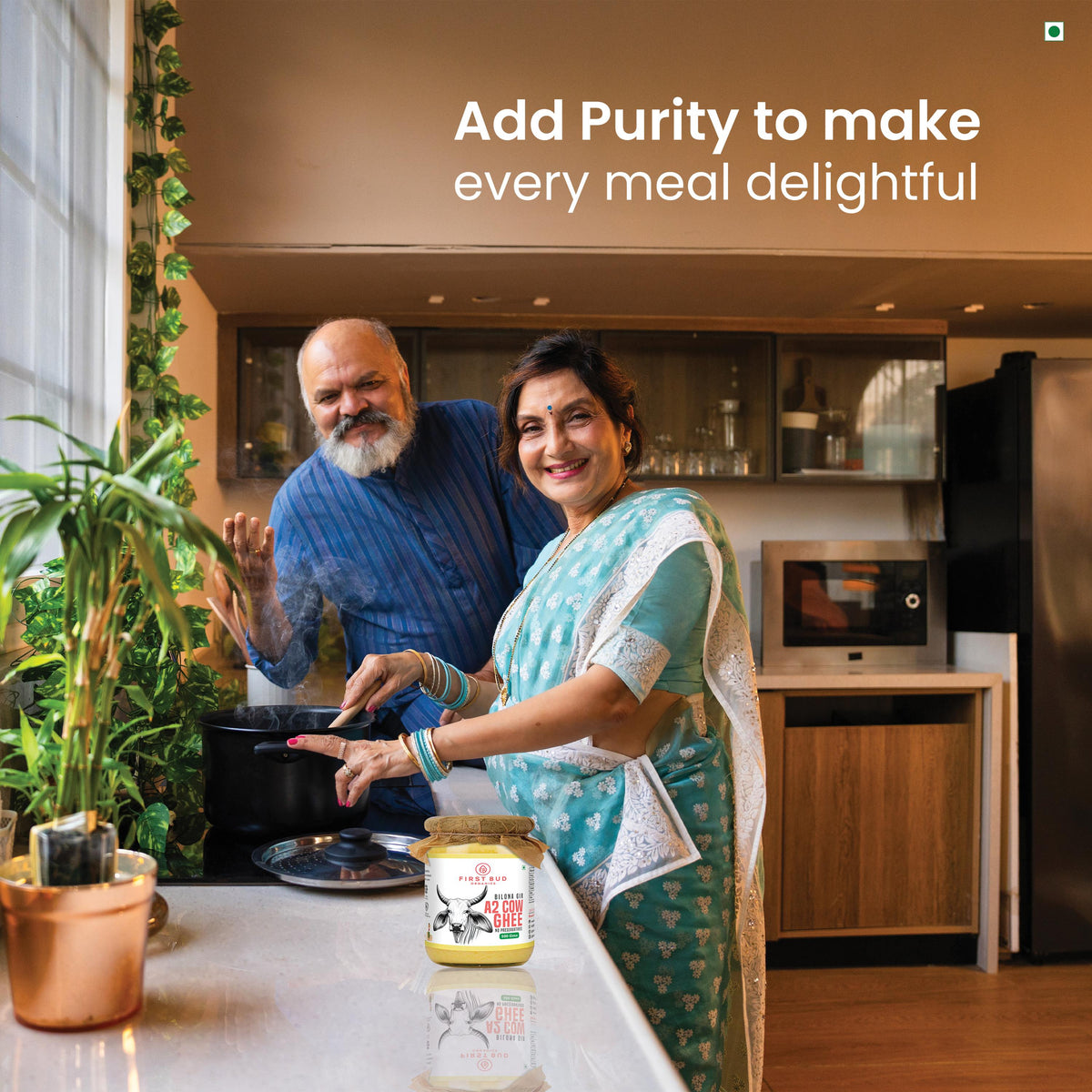 Couple cooking with First Bud A2 Gir bilona ghee in kitchen