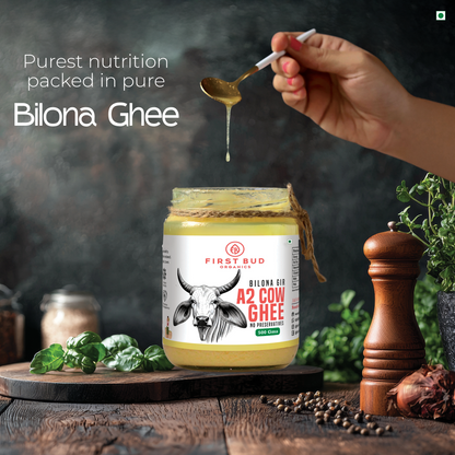 First Bud A2 Gir bilona ghee poured from spoon into jar